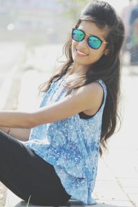 Portrait of young woman wearing sunglasses