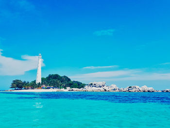 Scenic view of sea against blue sky