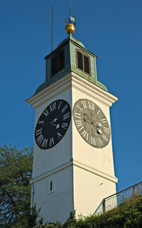 Low angle view of clock tower against sky