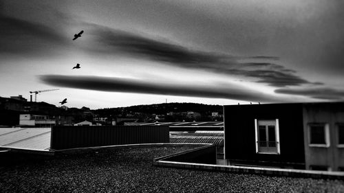 View of buildings against cloudy sky