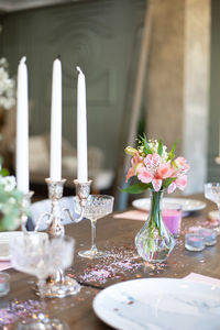 Flowers in glass vase on table