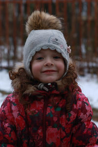 Portrait of smiling girl wearing warm clothing during winter