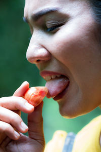 Close-up of man eating food