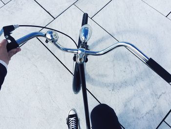 Cropped image of person riding bicycle