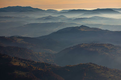 Scenic view of mountains against sky during sunset