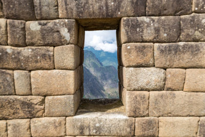 Close-up of stone wall against sky
