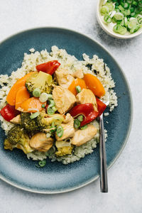 Paleo sweet and sour chicken over cauliflower rice