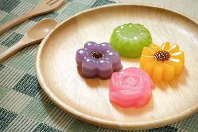 High angle view of multi colored candies on table