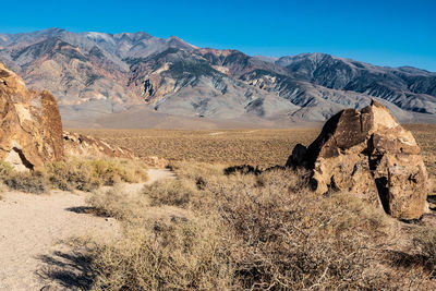 Desert trail in chidago canyon rock formations owens valley california