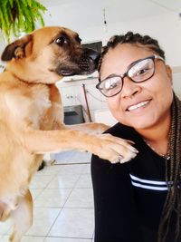 Portrait of smiling woman with dog