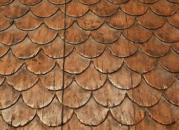 Detail of an ancient wood carved door, tuscany, italy