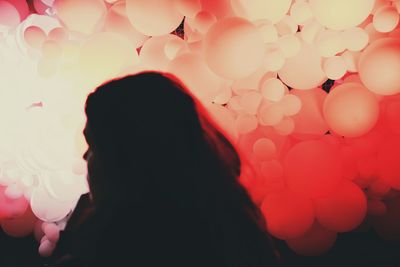 Rear view of silhouette woman against sky