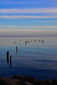 Scenic view of sea against sky at sunset