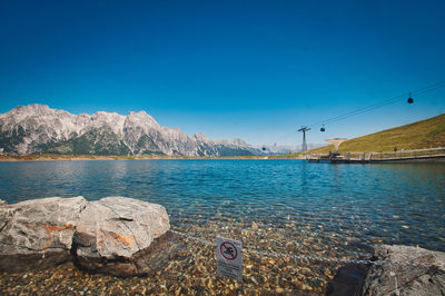 Scenic view of sea against blue sky