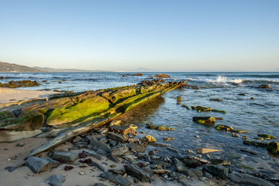 Scenic view of sea against clear sky