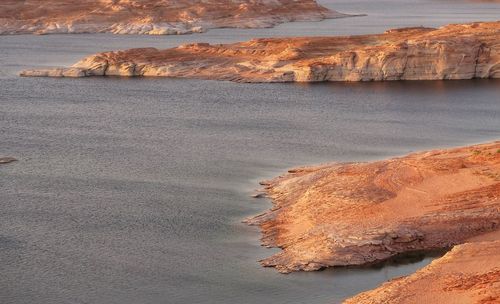 High angle landscape of lake powell and colorful shoreline fingers