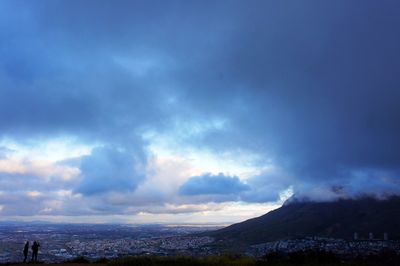 Scenic view of mountain against dramatic sky