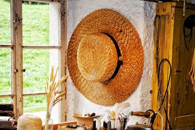 Wicker basket on table against wall at home