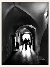 People walking in tunnel