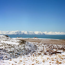 Scenic view of mountains against cloudy sky