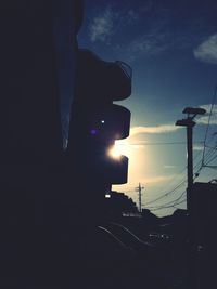 Low angle view of built structure against sky at sunset