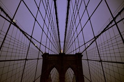 Low angle view of brooklyn bridge against sky during sunset