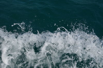 High angle view of water splashing in sea