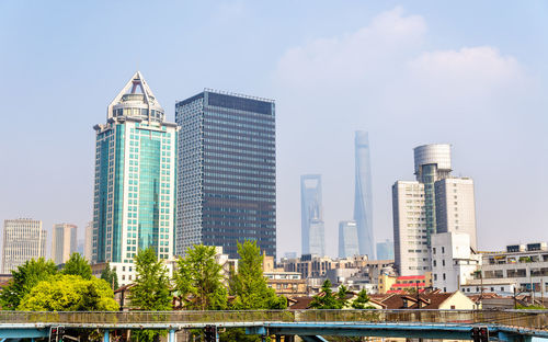 Modern buildings in city against sky