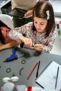 High angle view of woman working at table