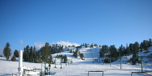 Ski resort hill with artificial snow in the morning before open
