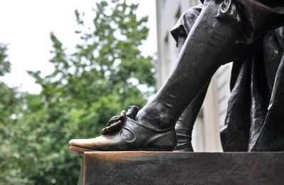 Close-up of statue against trees