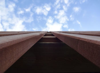 Directly below shot of wood structure against sky