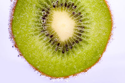 Close-up of fruit over white background