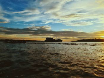 Scenic view of sea at sunset