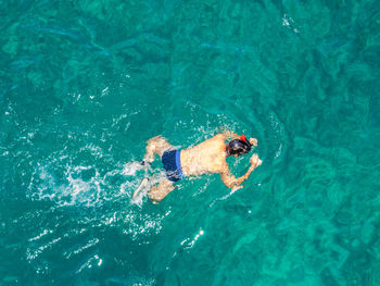 High angle view of man swimming in pool