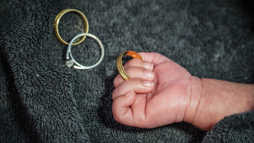 Close-up of baby holding hands