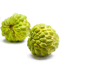 Close-up of fruits against white background