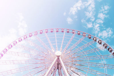 Low angle view of ferris wheel against sky