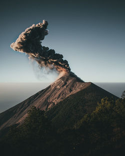 Scenic view of volcanic mountain against clear sky