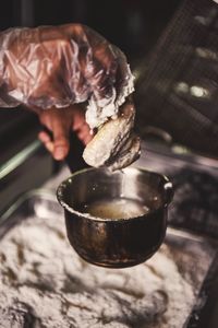 Cropped hands preparing food