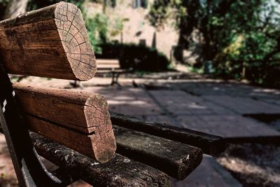 Old wooden bench on walkway