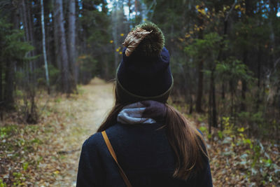 Rear view of woman in forest