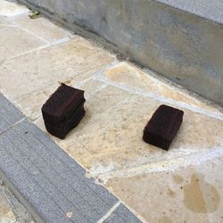 High angle view of stone on footpath