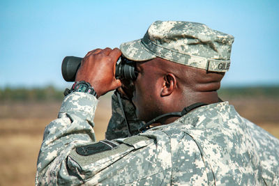 Close-up of senior man against clear sky