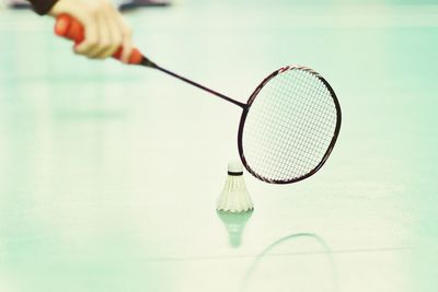 Cropped image of person playing badminton