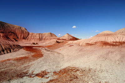 View of desert against blue sky