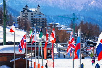 Panoramic view of flag on snow covered city