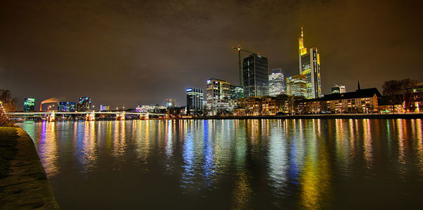 Illuminated city at waterfront