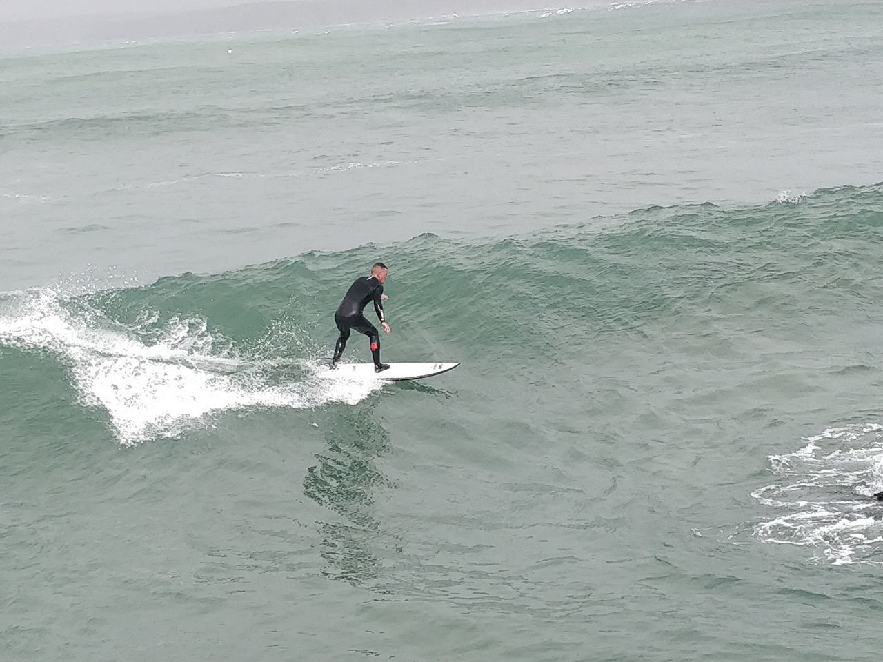 FULL LENGTH OF MAN ON SEA SHORE