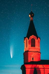 Low angle view of illuminated building against sky at night